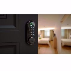 an electronic door lock on the side of a door in a room with a bed