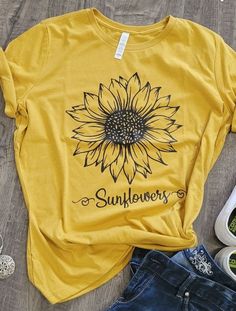 Sunflower graphic tee Yellow Graphic Tee With Floral Print, Spring T-shirt With Text Print, Spring Graphic Tee With Print, Spring T-shirt With Front Print And Relaxed Fit, Spring Sunflower Print Crew Neck Top, Spring Floral Graphic Print Top, Spring Letter Print Graphic Tee, Spring Graphic Tee With Letter Print, Spring Graphic Tee With Text Print