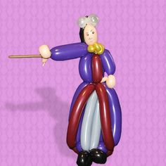 an inflatable clown holding a stick