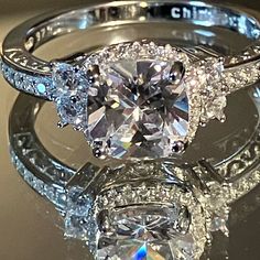 two engagement rings with diamonds on them