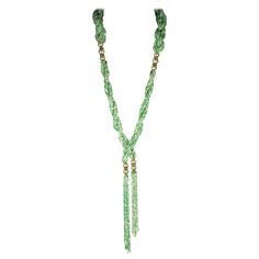 Long French Art Deco 1920s Lariat composed of multi strand, braided twists of opaque faux jade and pearl micro seed beads. Beautifully crafted with hand blown glass faux pearl and crystal paste rondelle spacers, terminating with two focal looped micro bead tassels. Made In France, 1920's. Excellent Condition. Luxury Green Lariat Necklace, Adjustable Green Beaded Lariat Necklace, Elegant Adjustable Green Lariat Necklace, Green Braided Bohemian Jewelry, Braided Twists, Blood Gang, Contemporary Jewellery Necklace, Dramatic Necklace, Necklace For