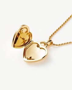 Engravable Heart Ridge Locket Pendant Necklace | 18ct Gold Plated Vermeil/Rainbow Moonstone. Make It Personal with this Engravable Pendant Necklace. Paired with a Delicate Chain, the Heart-Shaped Locket Features a Central Rainbow Moonstone Gem and Signature Ridge Detailing. It Can be Engraved on the Back, as Well as Inside the Locket. Add a Date, Meaningful Message or Personalized Motif to Create a One-Of-A-Kind Jewelry Gift. Please Note: Engraving Items May Take 7-10 Working Days to Process. Me Fine Jewelry Heart-shaped Locket, Fine Jewelry Heart Locket, Fine Jewelry Keepsake In Yellow Gold, Fine Jewelry Yellow Gold Keepsake, Yellow Gold Keepsake Fine Jewelry, Yellow Gold Fine Jewelry For Keepsake, Fine Heart-shaped Locket Jewelry, Gold Plated Locket Necklace, Gold Heart Necklace With Birthstone For Keepsake