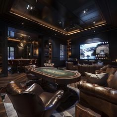 a game room with couches, chairs and a table in front of a tv