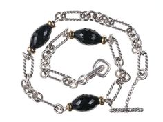 18K yellow gold and sterling silver David Yurman Figaro chain necklace featuring
black onyx faceted beads with toggle closure. Very fine pre-owned condition with
no damage or detectable wear. 39.7 grams 7mm wide. Black Sterling Silver Jewelry With Oval Link, Black Oval Link Cable Chain Jewelry, Black Jewelry With Oval Link Cable Chain, Elegant Black Jewelry With Cable Chain, Formal Black Jewelry With Cable Chain, Formal Black Cable Chain Jewelry, Classic Black Necklace With Cable Chain, Figaro Necklace, Figaro Chain Necklace