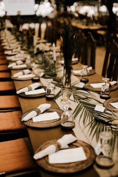 a long table set with place settings and napkins