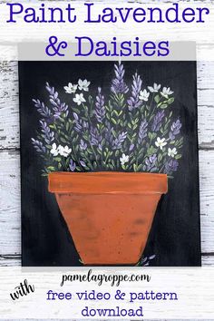 a potted plant with lavender and daisies painted on it