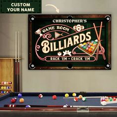 a billiards sign hanging on the wall above a pool table