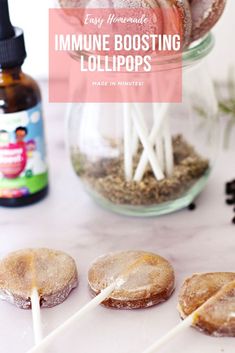 some lollipops are sitting on a table with the words easy homemade mini - boosting lollipops