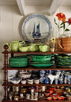 a shelf filled with lots of plates and bowls