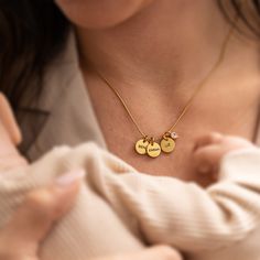 "Introducing our stunning stainless steel necklace with a captivating snake texture. This unique piece combines delicate circle pendants with the heartfelt touch of engraving your children's names on them. With the ability to engrave up to 8 names, this necklace ensuring a personalized and cherished accessory. Engraved with your precious little ones' names, this necklace is a commemoration of the love that knows no bounds. To add an extra touch of elegance, our necklace is adorned with a dazzlin Stainless Steel Charms Necklaces For Anniversary, Custom Name Round Pendant Necklace In Stainless Steel, Stainless Steel Name Necklace With Round Pendant, Anniversary Stainless Steel Charm Necklaces, Stainless Steel Charms Necklace For Anniversary, Custom Name Stainless Steel Round Pendant Necklace, Anniversary Stainless Steel Charms Necklace, Stainless Steel Round Pendant Necklace With Name, Personalized Yellow Gold Charm Necklace In Stainless Steel