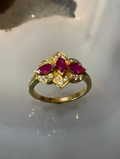 Classic Marquise Ruby Ring With Vvs Clarity, Cluster Ruby Diamond Ring With Center Stone, Luxury Ruby Marquise Cut Rings, Elegant Marquise Ruby Ring With Vvs Clarity, Marquise Ruby Ring With Diamonds, Formal Marquise Ruby Ring With Diamond, Marquise Cut Ruby Ring With Diamond, Formal Marquise Cut Ruby Ring With Diamonds, Formal Marquise-cut Ruby Ring With Diamond Accents