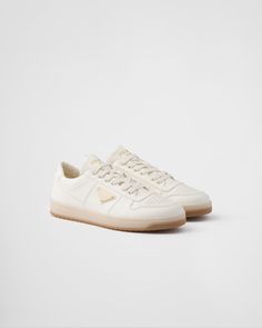 Ivory Downtown Nappa Leather Sneakers | PRADA Beige Lace-up Sneakers With Embossed Logo, Cream Calf Leather Sneakers With Textured Sole, Classic Beige Sneakers With Leather Sole, Luxury Cream Sneakers With Textured Sole, Cream Sneakers With Leather Sole For Streetwear, Classic Cream Sneakers With Leather Sole, Classic Cream Leather Sneakers, Luxury Beige Leather Sneakers, Luxury Sneakers With Gum Sole