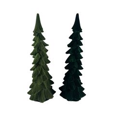 two tall green trees sitting next to each other on top of a white surface in front of a white background