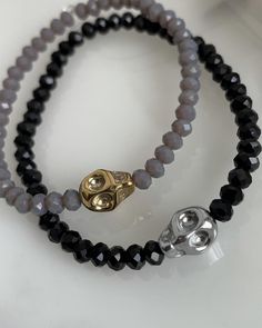 Black or Charcoal Gray Crystal beads with a skull charm. Skulls are available in gold, silver, or rainbow. Be sure to indicate your size in the personalization box as well as any other custom details you would like!  XS-6 inches S-6.5 inches M-7 inches L-7.5 inches XL-8 inches Silver Skull Print Bracelets As A Gift, Silver Skull Beaded Bracelets As Gift, Goth Bracelets, Bracelets Beads, Beads Bracelet Design, Bracelet Design, A Skull, Oct 31, Beads Bracelet