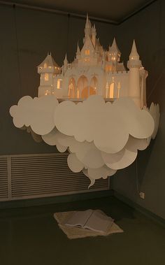 a chandelier hanging from the ceiling in a room with a castle on it