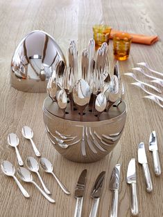 silverware and utensils on a wooden table