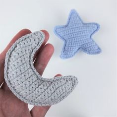 two crocheted stars and a crescent are shown in front of a hand holding one