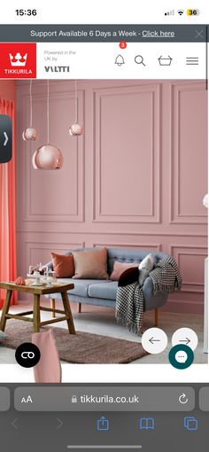 an image of a living room with pink walls and furniture in the background, including a couch