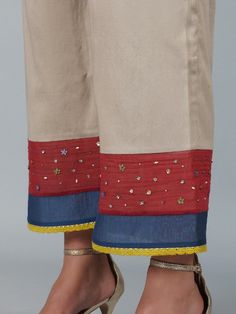 A wrap style side tie-up kurta with lace details is paired with an applique work dupatta and elasticated waist pants. Color: Beige and Garent Red Fabric: Chanderi and Glace Cotton Note: Wash Care - Dry Clean only The product will be delivered within 3-4 weeks of order placed Relaxed Fit Embellished Clothes, Blouse Yoke, Applique Work, Beads Work, Suits Design, Smart Outfit, Boutique Dress, Pants Design, Floral Applique