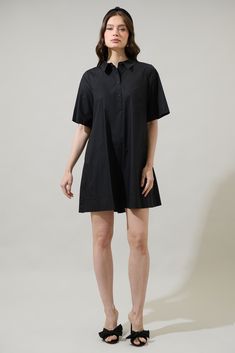 The Danbury Collared Trapeze Mini Dress will have you wanting to spend the day out. It features short sleeves and a button up front leading to a collared neck. The back has an inverted pleat design. It can be easily paired up with sandals or strappy heels. - Pockets- Flutter sleeves- Button up- Boxy fit- Comes in 2 colorsSize + Fit - Model is 5'8" and wearing size XS- Measurements taken from size S - Chest: 19 1/2"- Length: 34 1/2" Fabric Self: 100% Cotton Style Number STD14556 Classic Short Sleeve Mini Dress For Work, Classic Short Sleeve Mini Dress, Short Sleeve Shirt Dress With Buttons For Work, Classic Short Sleeve Mini Dress For Summer, Classic Summer Mini Dress With Short Sleeves, Short Sleeve Mini Dress With Buttons For Work, Short Sleeve Dress With Button Closure For Work, Classic Short Sleeve Mini Dress For Spring, Classic Short Sleeve Shirt Dress