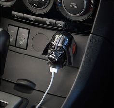 a darth vader mask plugged in to a car's charger