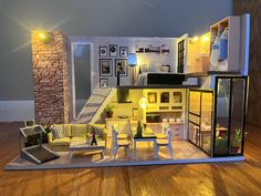 a doll house is shown with furniture and lighting