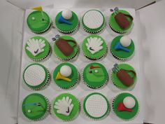 the cupcakes are decorated with green icing and sports related items on them