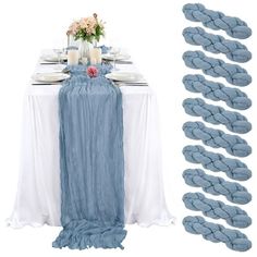 the table is set up with blue and white linens