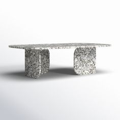 a table made out of concrete with two legs