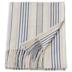 a white and blue striped blanket with fringes