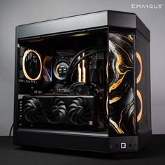 the inside of a computer case with gold and black designs