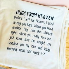 a handkerchief with the words hugs from heaven written on it