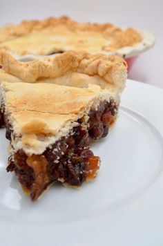 a piece of pie sitting on top of a white plate