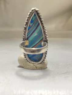 "Rainbow Casilica Ring sterling silver women girls Size 6.75 Weight 7.4g Length 1. 3/4\" Width. 3/4\" Thinnest part of band 1/8\" Free Shipping & Free Postal Insurance Delivered in a Gift Box If you do not want the ring polished and want to leave the natural patina please let me know at the time of purchase as I do polish rings before I ship rings out. Thanks USPS Domestic Shipping is free for buyers. If a buyer prefers to upgrade to priority, the buyer will pay that portion of the shipping Rainbow Sterling Silver Jewelry Gift, Rainbow Sterling Silver Jewelry, Adjustable Rainbow Sterling Silver Jewelry, Elegant Rainbow Sterling Silver Rings, Southwest Boho, Poison Ring, Sterling Silver Multi-stone Turquoise Ring Gift, Sparkly Ring, Everyday Rings