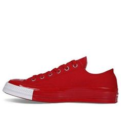 The latest release from iconic shoe brand Converse is the Chuck 70 OX Low, a modern take on a classic silhouette. Unveiled during 2018 Paris Fashion Week, this shoe features a unique color-blocked design with Racing Red and white accents. The canvas upper is complemented by a shiny rubber toe cap printed with “Order” and “Disorder” lettering. The vulcanized midsole and red rubber outsole complete the look of this stylish and comfortable shoe. Whether you’re hitting the streets or the gym, the Chuck 70 OX Low is a great choice for any activity. (SNKR/Retro/Unisex/Low Top) Modern Converse Sneakers With Rubber Sole, Modern Low-top Sneakers With Rubber Toe Cap, Chuck 70 Low, Converse Chuck 70, Chuck 70, White Accents, Classic Silhouette, Boys Clothing, Chucks Converse