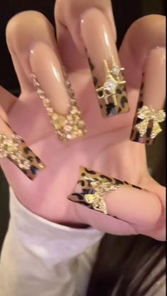 Junk Nails Long, Black Nails With Gold Charms, Scorpio Nails Acrylic, Sharp Nails Design, Capricorn Nails Designs, Birthday Nails Gold, Brown Baddie Nails, Gold Rhinestone Nails, Nails Acrylic Brown