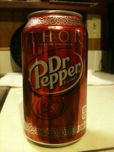 a can of dr pepper beer sitting on top of a counter