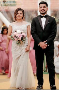 the bride and groom are walking down the aisle