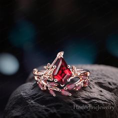 a red ring sitting on top of a rock