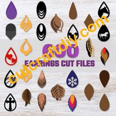 various earrings cut files are displayed on a wooden surface with the words,'enjoy 50 earings cut files '