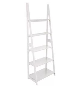 a white ladder shelf with three shelves