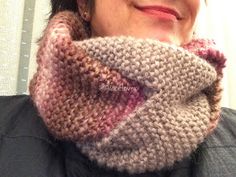 a close up of a person wearing a scarf