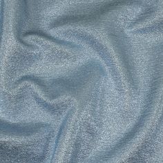 an up close shot of the fabric in light blue color, it is very soft