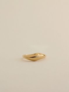 Our most popular Yin Ring celebrates organic shapes and the beauty of balance. At first glance, it appears as a sleek dome ring shining on your finger. Upon closer inspection, you'll notice a charming wobble at the top, creating a gentle wave that nestles well against another Yin Ring. People love stacking two together, often mixing metals for a unique look. We wear this ring as a reminder that the beauty of balance and movement can be more rewarding than static symmetry. Mixing Metals, Gold Rings Simple, Dome Ring, Solid Gold Rings, Domed Ring, Detail Shop, Ring Collections, Perfect Ring, Organic Shapes