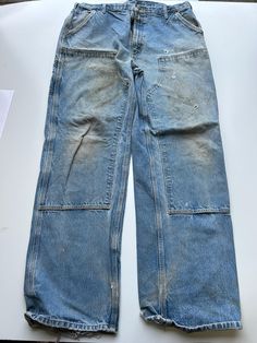 Mens Carhartt Double Knee Trouser Heavy duty material 1990s vintage  Regular Fit  Zip Fly  Blue Waist 40 inch Leg Length 35 inch **Sizes are exact measurement of the jean and may differ from the tag size** Please note due to the nature of these being workwear jeans there will be cool signs of fraying / paint and fading marks. All adding to the character of the piece** Item in great workwear condition overall Vintage Straight Leg Cargo Jeans For Streetwear, Vintage Straight Leg Cargo Pants For Streetwear, Vintage Full Length Cargo Jeans For Streetwear, Vintage Full Length Cargo Pants For Streetwear, Retro Faded Bottoms With Pockets, Vintage Full-length Bottoms For Streetwear, Vintage Straight Leg Cargo Pants With Five Pockets, Vintage Streetwear Bottoms With Belt Loops, Vintage Bottoms With Belt Loops In Faded Color