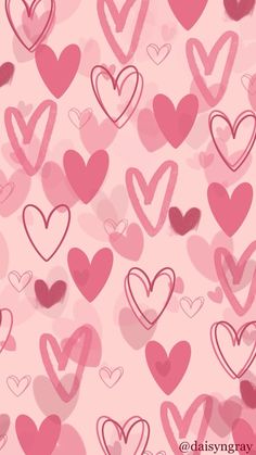 pink and red hearts are arranged in the shape of heart shapes on a pink background