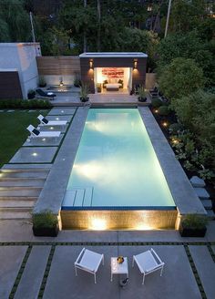 an aerial view of a pool at night