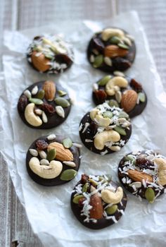 chocolate covered donuts with nuts, almonds and pistachio