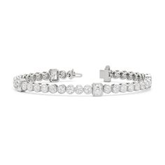 A sweeping sense of sophistication is deeply embedded within this tennis bracelet's timeless design. Bezel-set radiant and round diamonds line up to form a pattern, leading the eye from one flash of sparkle to another. Fastening the bracelet onto your wrist is a secure tongue-and-clip clasp. Luxury Diamond White Tennis Bracelet With Bezel Setting, Elegant Tennis Bracelet In Diamond White With Bezel Setting, Elegant Diamond White Tennis Bracelet With Bezel Setting, Classic Bezel Setting Tennis Bracelet For Formal Occasions, Luxury Tennis Bracelet In Diamond White With Bezel Setting, White Gold Channel Set Diamond Bracelet, Elegant Diamond Tennis Bracelet With Bezel Setting, Luxury Diamond Tennis Bracelet With Channel Set, Classic Round Tennis Bracelet With Bezel Setting