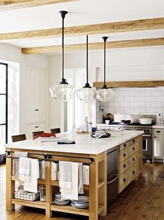 a kitchen island with lots of white towels hanging from it's sides and the words, not central danish la cuisinee 4 idees & inspirations